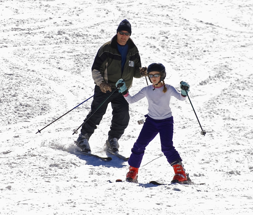 Parent and child skiing