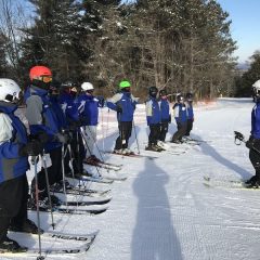 Instructors in a skiing clinic