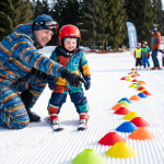 A parent and child on a gentle beginner slope, smiling, with the parent pointing toward a simple “follow-the-leader” path in the snow.